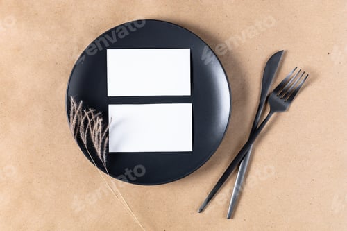 Preview: Blank white paper card on plate for mock up with dried spikelets decoration on craft beige