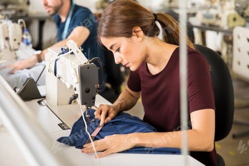 Preview: Seamstress using tape measure