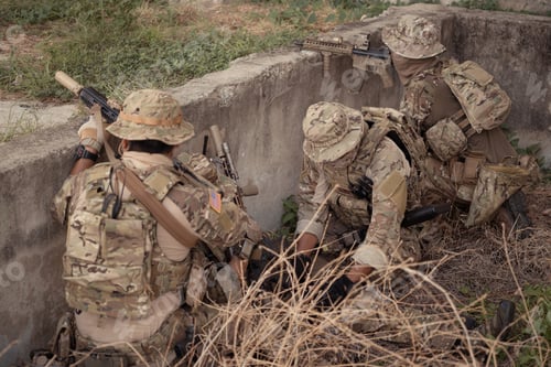 Preview: Professional marine soldiers training with weapon on a military range.