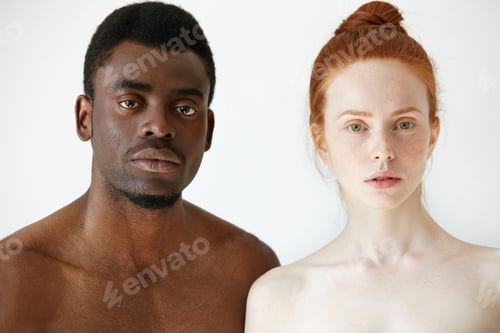 Preview: True love between two young people of different races. Headshot of freckled redhead Caucasian woman
