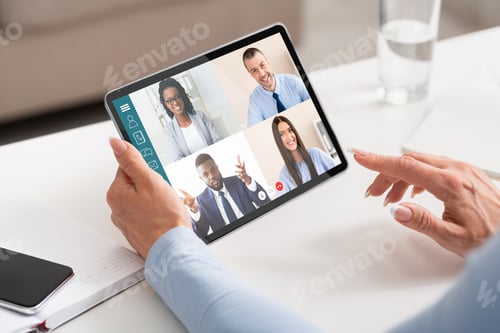 Preview: Unrecognizable lady entrepreneur having online conference with her business partners