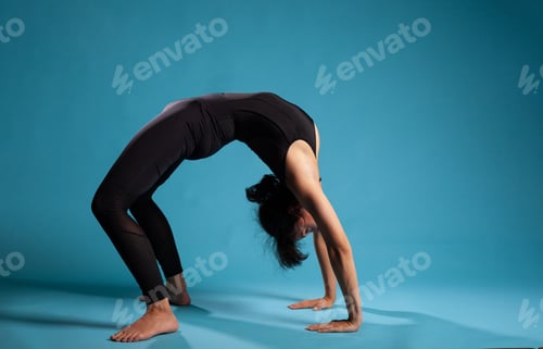 Preview: Personal trainer practicing urdhva dhanurasana exercise