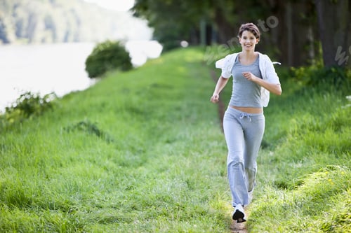Preview: Germany, Bavaria, Young woman jogging