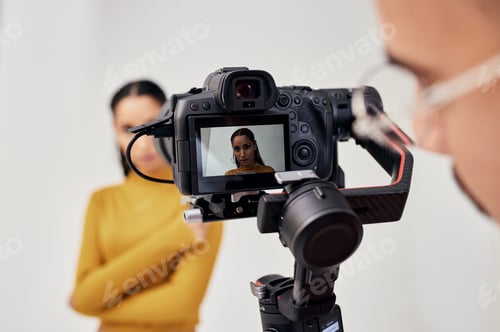 Preview: Photography, woman and photographer shoot fashion model in studio for creative, advertising and ima