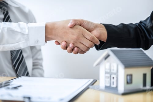 Preview: Real estate agent are shaking hands after good deal and giving house