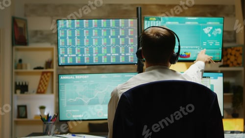 Preview: Excited stock market trader with hands up