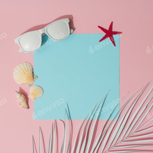 Preview: Beach accessories and palm leaves on pastel pink and blue background with copy space.