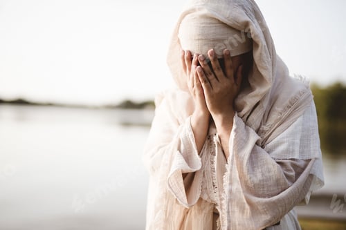 Preview: Closeup shot of a female wearing a biblical robe crying - concept confessing sins