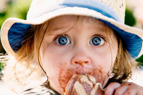 Preview: Young girl eating ice cream cone