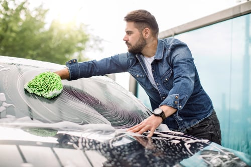 Preview: Horizontal view of car cleaning at self wash service outdoors.