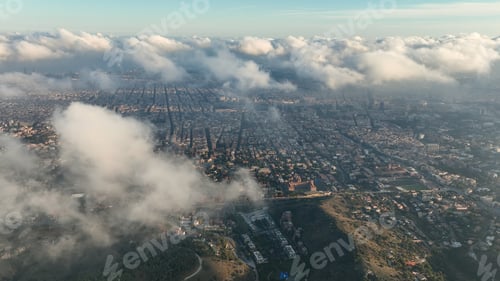 Preview: Aerial view of Barcelona City skyline above the clouds and fog, Catalonia, Spain
