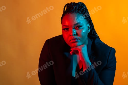 Preview: Beauty portrait fashion girl with color neon lighting filters. Beauty girl face close up. Closeup