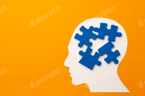 Preview: Papercut head silhouette with puzzle pieces on yellow background