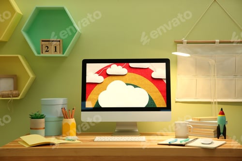 Preview: Stylish workplace with computer on wooden desk near light green wall. Interior design