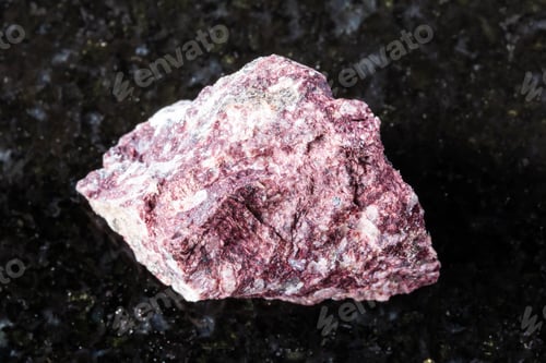 Preview: sample of raw piemontite mineral on black granite