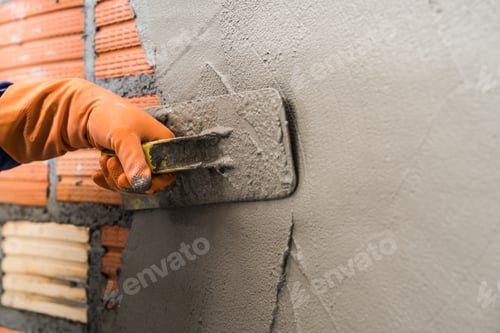 Preview: Hand worker plastering cement wall background interiors