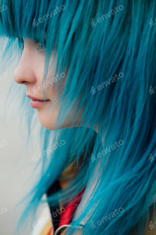 Preview: Young woman with dyed blue hair, close-up