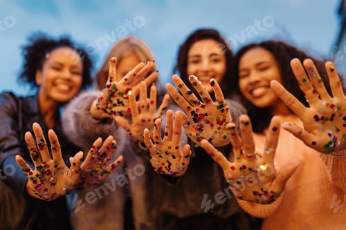 Preview: Close up shot of female hands with confetti, showing in camera
