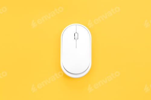 Preview: Computer mouse on a yellow background isolated, flat lay.