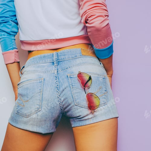 Preview: Vanilla Summer. Model in a fashionable T-shirt and denim shorts