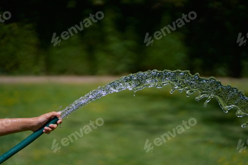 Preview: Selective focus shot of a hose water stream