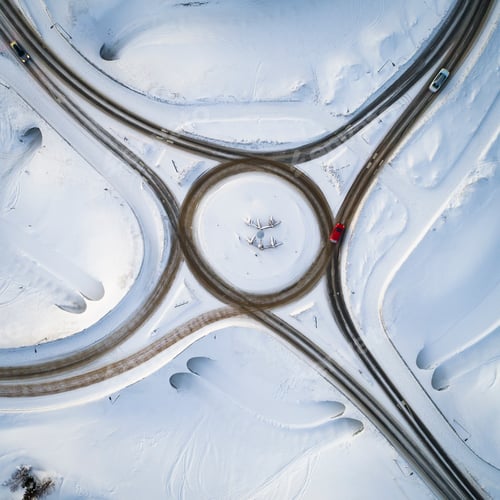 Preview: Aerial drone view of road in idyllic winter landscape