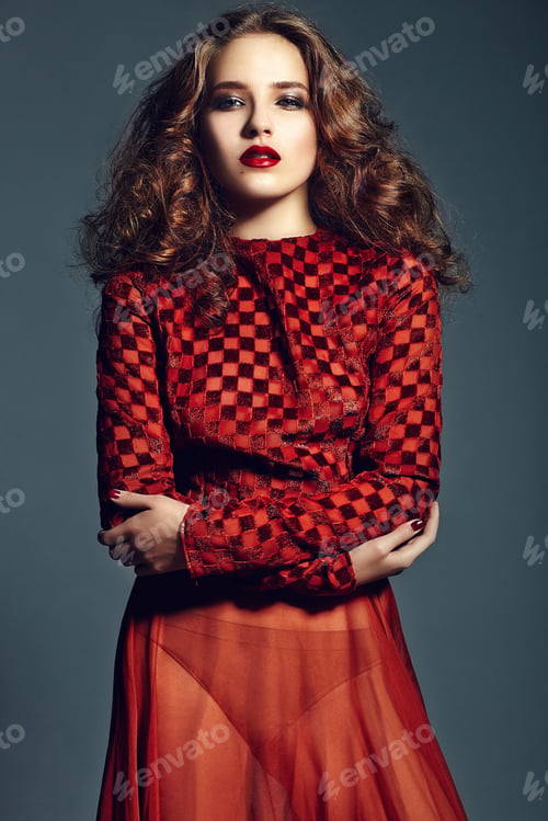 Preview: Beautiful model with bright makeup posing in studio