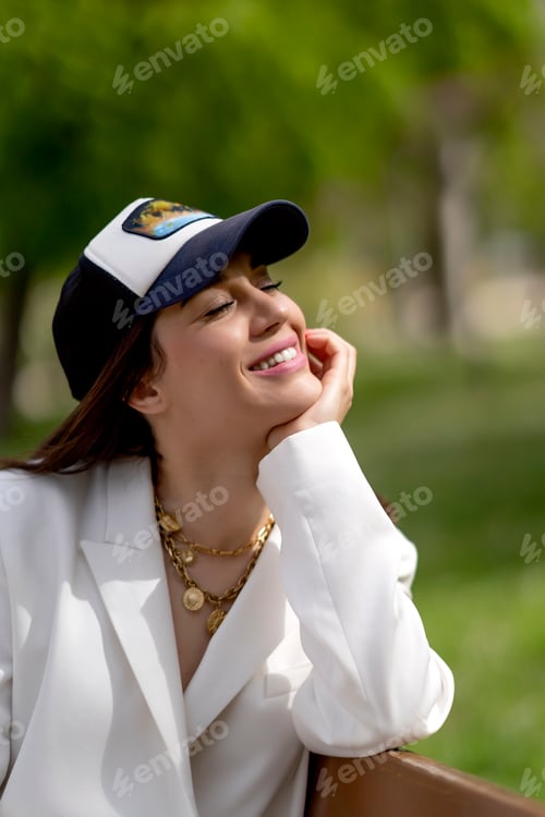 Preview: Close-up shot of a woman wearing a suit and cap