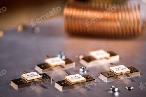 Preview: Close-up of five metal plates on a large iron case