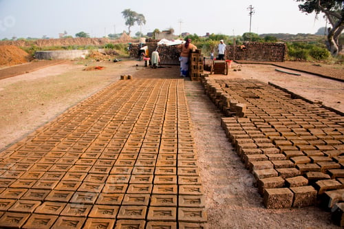 Preview: Indian worker making house bricks