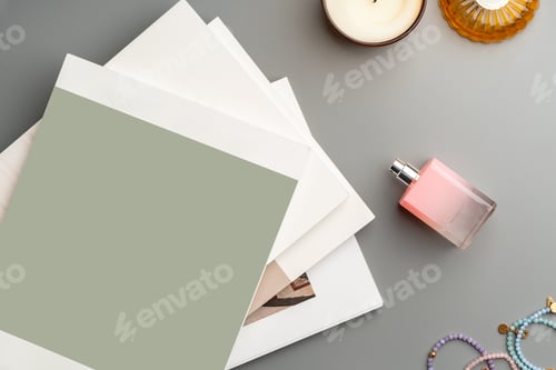 Preview: Creative workspace arrangement featuring stationery, accessories, and ambient lighting on a stylish