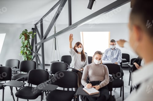 Preview: Asking a question on a business seminar.