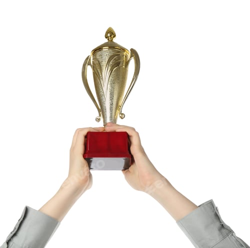 Preview: Woman with golden trophy cup on white background, closeup