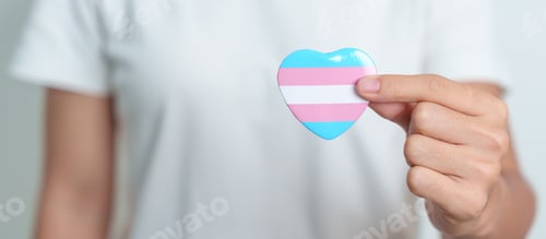 Preview: Transgender Day and LGBT pride month, LGBTQ+ or LGBTQIA+ concept. hand holding blue