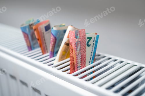 Preview: euro banknotes in a central heating radiator, the concept of expensive heating costs, closeup