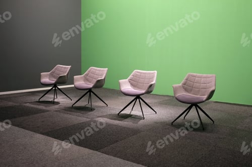Preview: Sofa chairs under the lights against a green screen in a studio