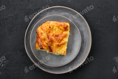 Preview: Top view of cheese puff pie from unleavened dough