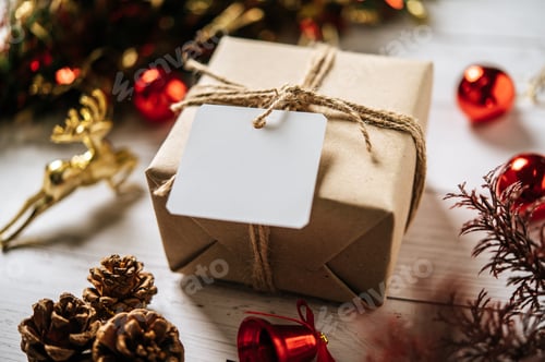 Preview: gift box with a small gift on a white wooden background