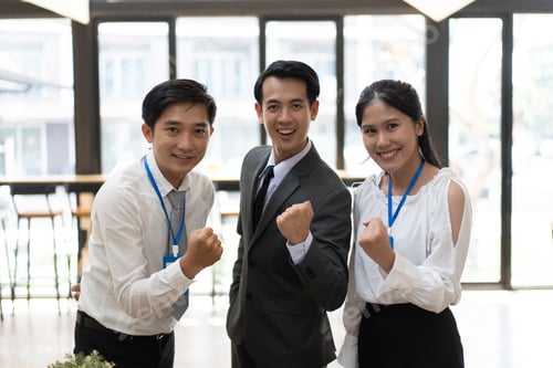 Preview: Happy Asian business people celebrating success at company.