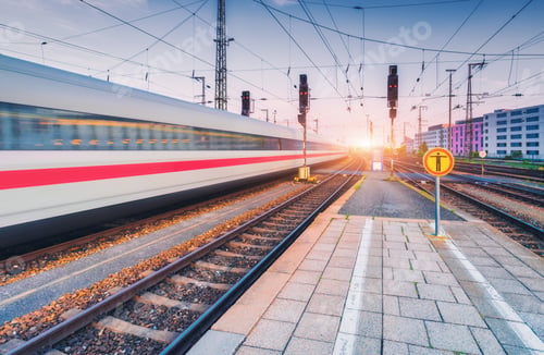 Preview: High speed train in motion on the railway station at sunset