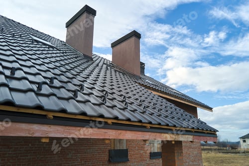 Preview: Closeup snow guard for safety in winter on house roof top