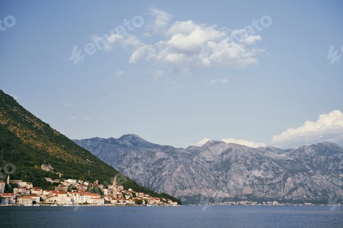 Preview: View from the sea to the ancient town of Perast at the foot of the mountains. Montenegro