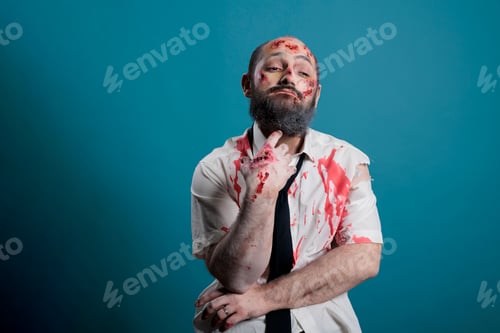 Preview: Thoughtful man with zombie makeup and costume