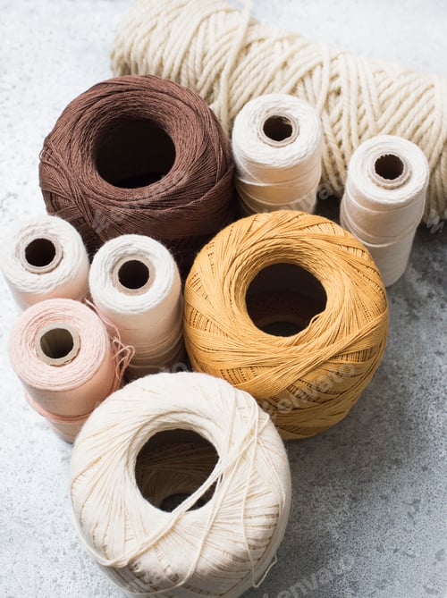 Preview: Still life with spools of yarn and string, overhead view
