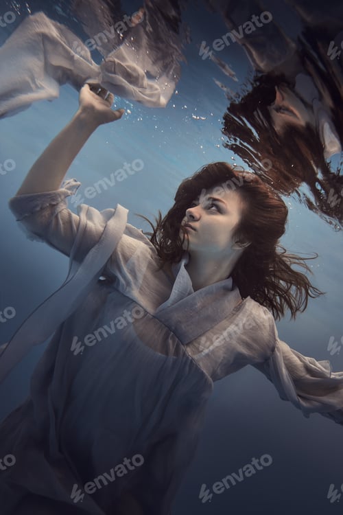 Preview: Portrait Of A Girl In A Blue Dress Under Water