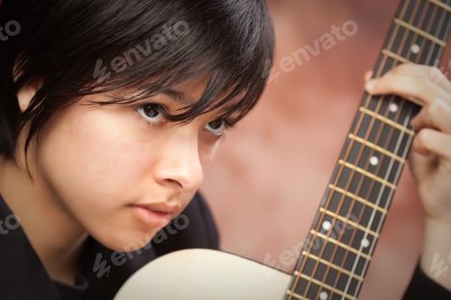 Preview: Attractive Ethnic Girl Plays Guitar