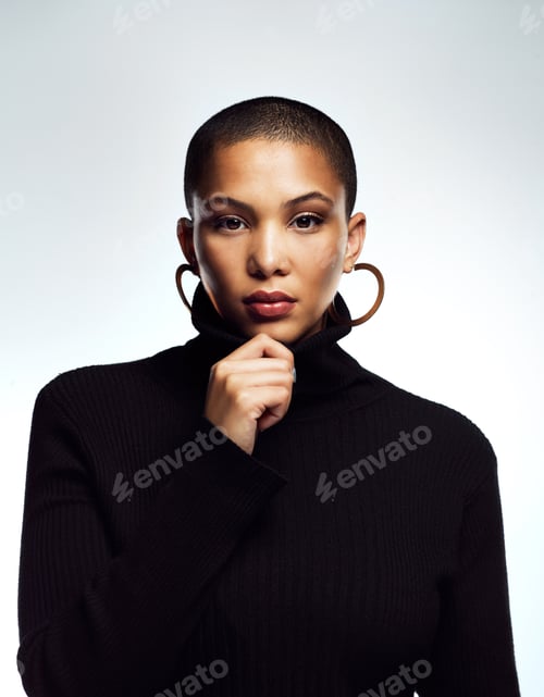Preview: Studio shot of an attractive young woman posing against a grey background