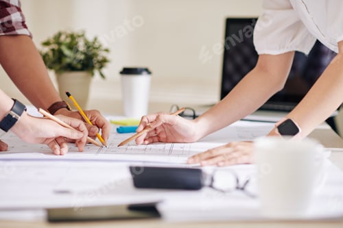Preview: Project managers discussing blueprint