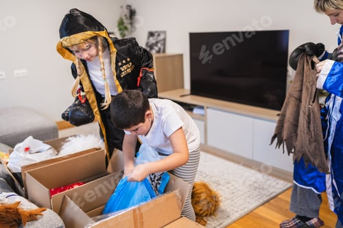 Preview: Children and mother trying on carnival costumes at home