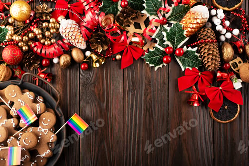 Preview: Christmas background of tray with gingerbread cookie men and rainbow flags on wooden table